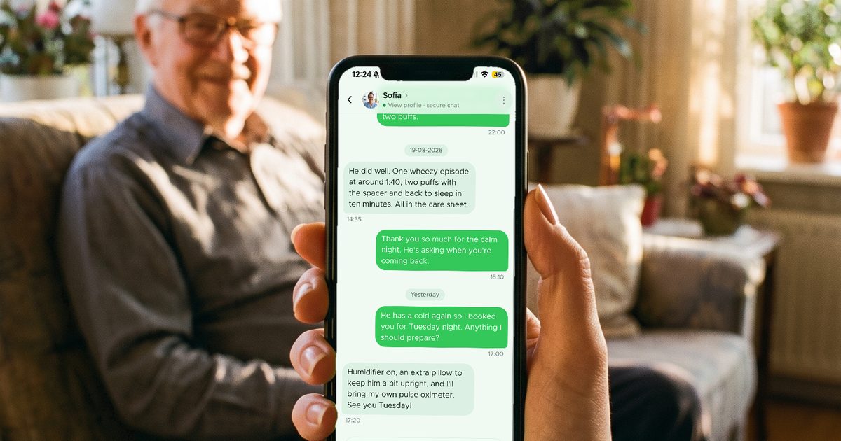 A family member messaging a caregiver on her phone while her father rests on the sofa behind her
