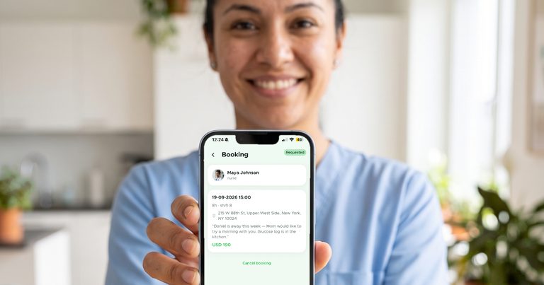 A nurse in scrubs holding up her phone to show a new booking request